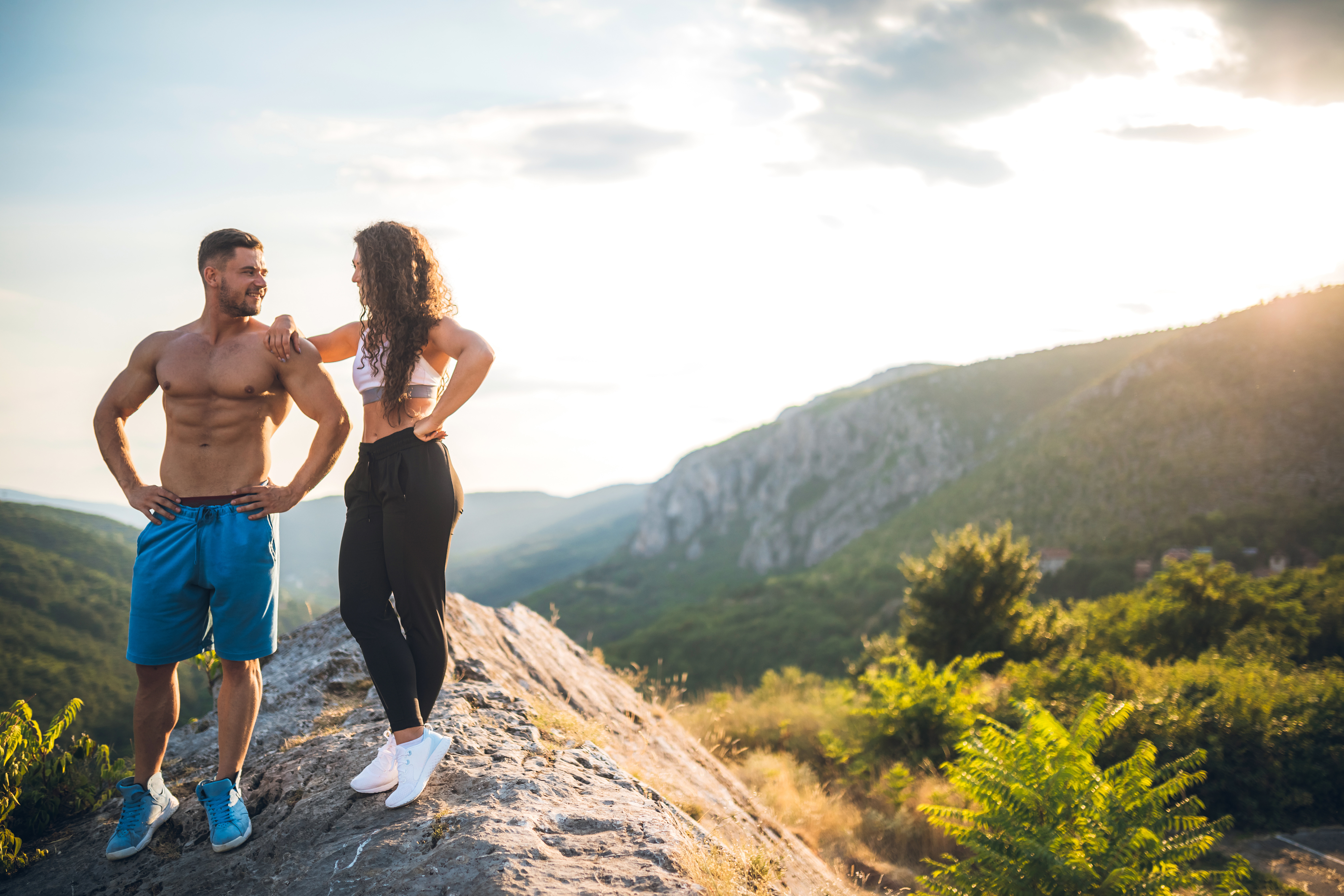 Fitness couple high on mountain